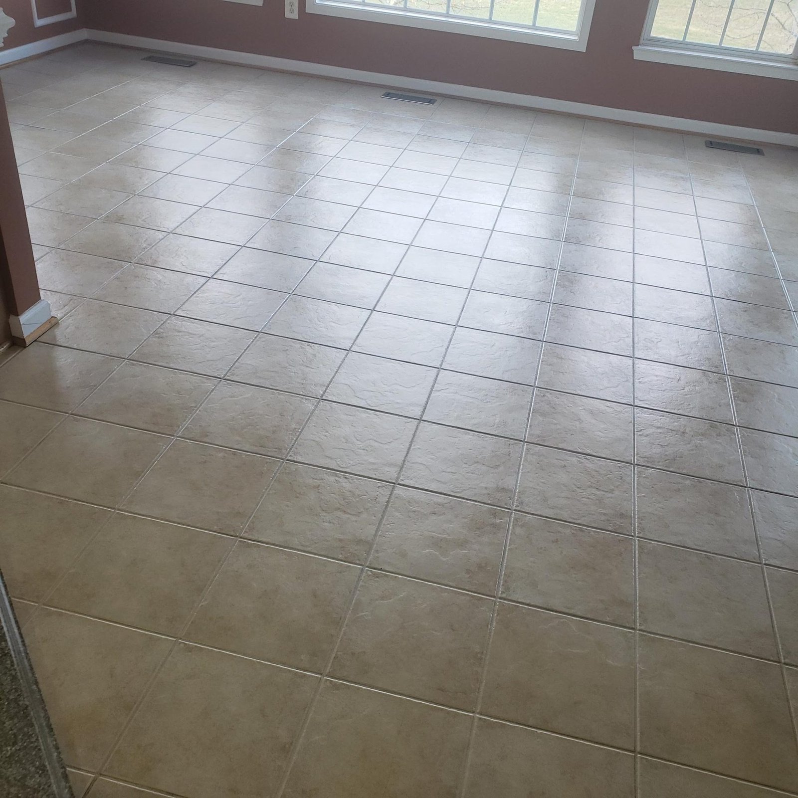 Cleaned ceramic tile floor with bright, refreshed grout lines