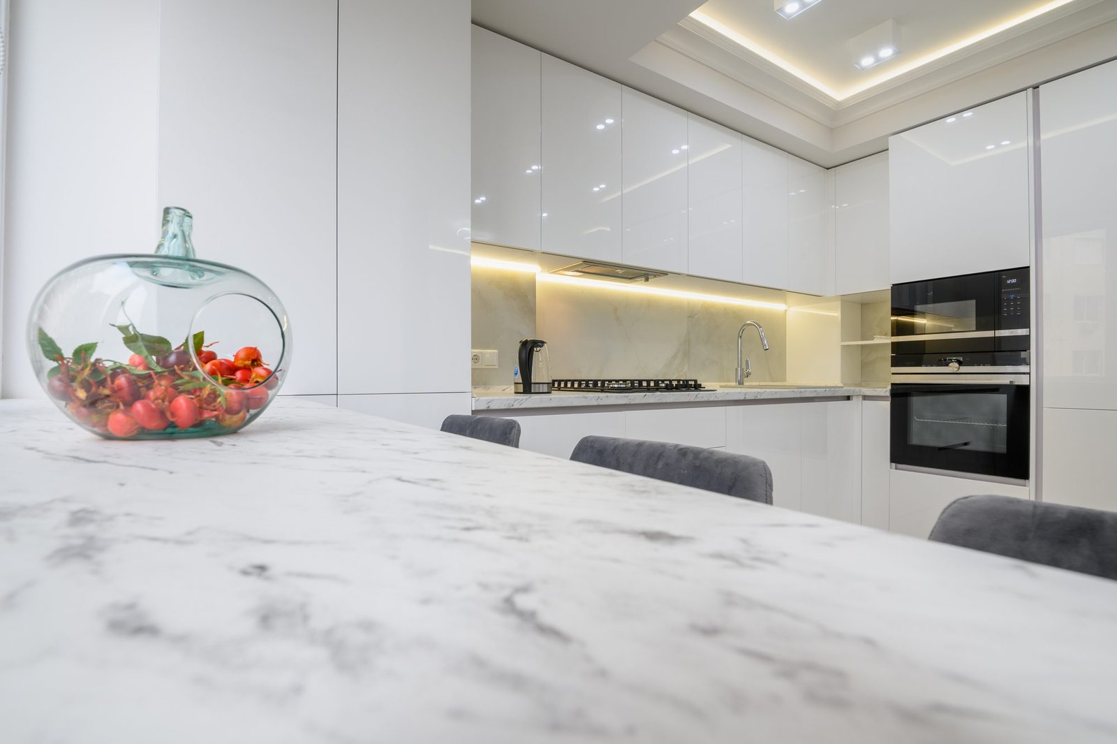 Polished white marble kitchen countertop in a modern interior