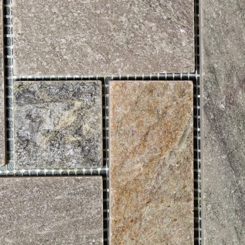 An assortment of natural stone tiles in neutral tones.