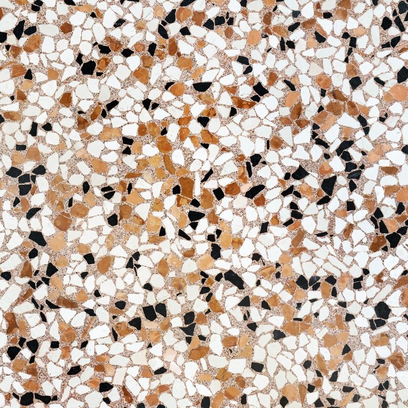 Close-up of a terrazzo surface with stone chips set in a matrix.
